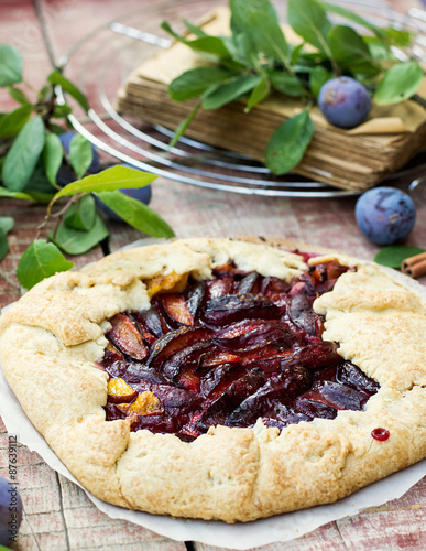 Rustic galette fruit tart with plums and cinnamon