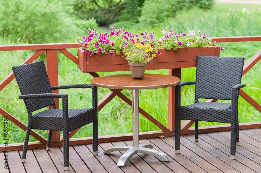 Outdoor terrace cafe table with two chairs