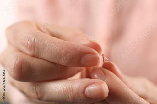 Closeup hands of seamstress at work