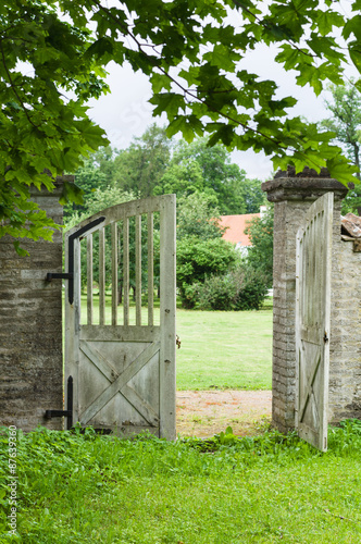 Opened wooden gate in park
