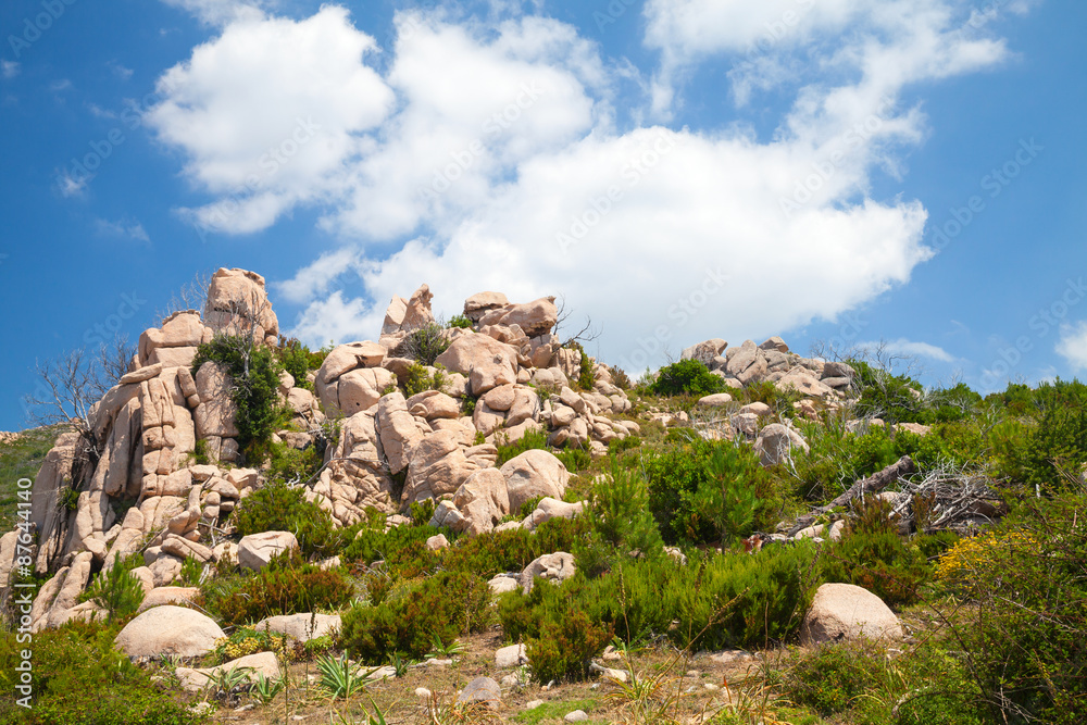 Corsica island, rocky mountains under cloudy sky Corsica island, rocky mountains under cloudy sky