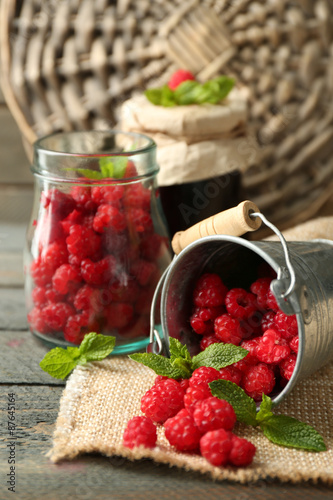 Sweet raspberries on wooden background