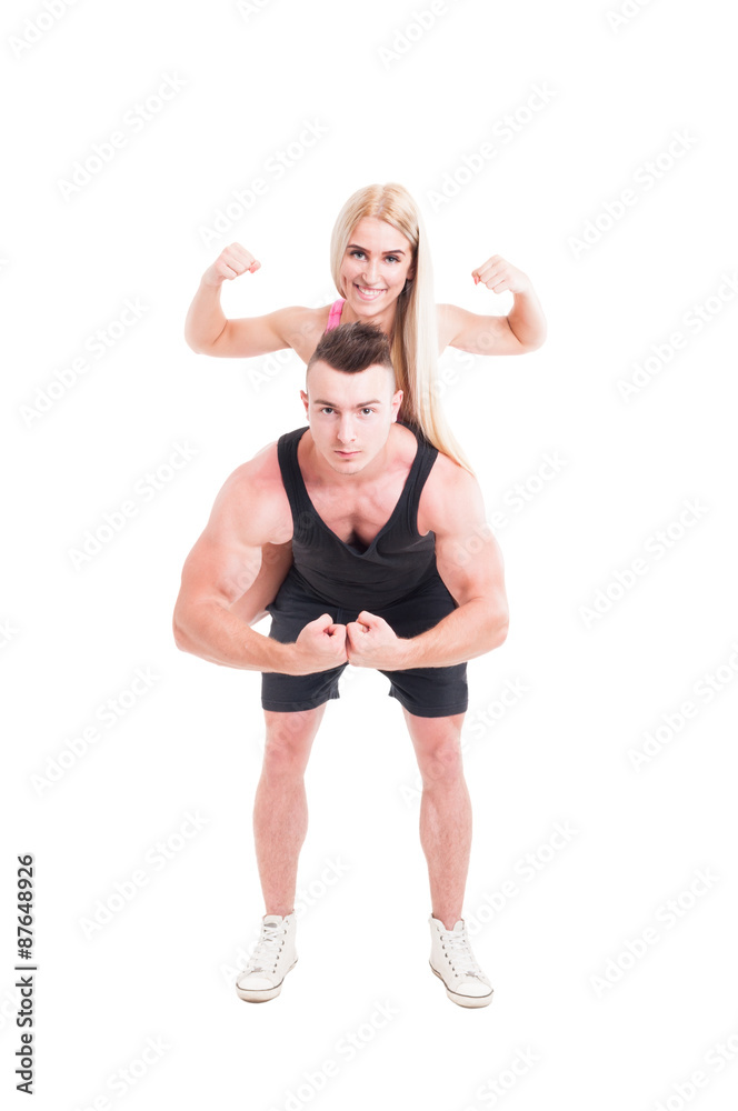 Strong fitness couple piggyback