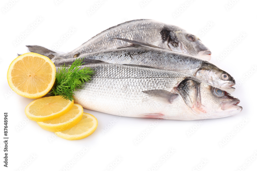 Fresh fish with dill and lemon isolated on white Fresh fish with dill and lemon isolated on white
