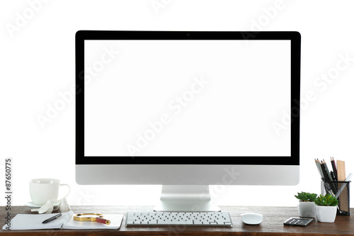 Computer on wooden table with blank white background