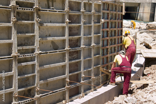 Working with prefabricated formwork on construction site