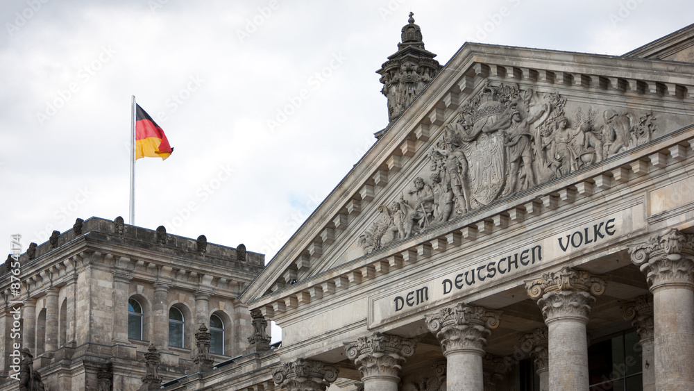 Obraz premium Reichstag, Berlin, Germany. The dedication on the face of the German parliament building, Dem Deutschen Volke, translates as 