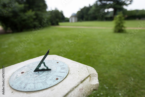 Sundial. Shallow focus on a sundial in an English parkland setting.