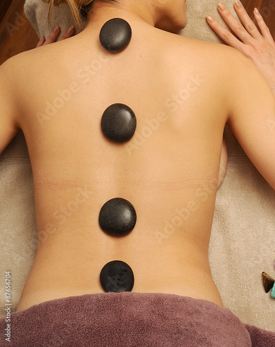 Hot stone massage in spa salon