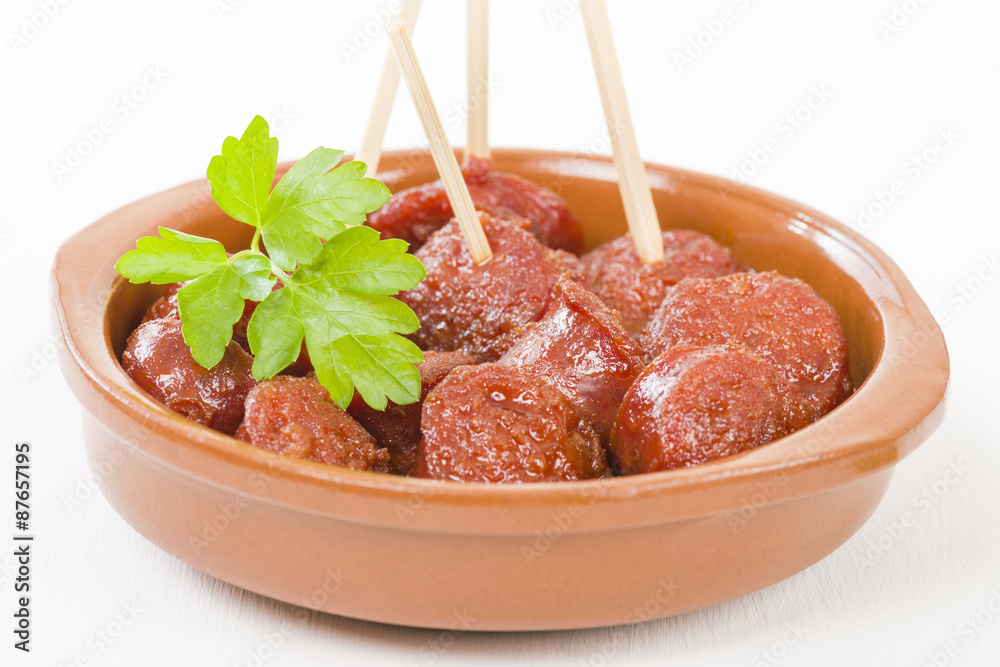 Chorizo a la Sidra Spanish spicy chorizo sausages cooked in cider. Stock Photo Adobe Stock