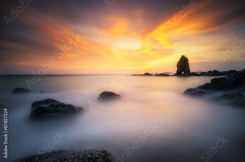 Sea wave hit the rock at sunset in Thailand © weerasak