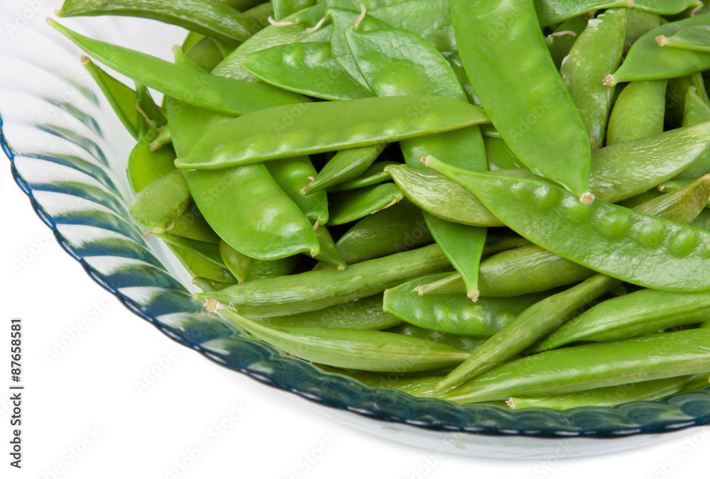 Snow Peas in a Bowl – Steamed snow peas in a glass bowl. White background. Snow Peas in a Bowl – Steamed snow peas in a glass bowl. White background.