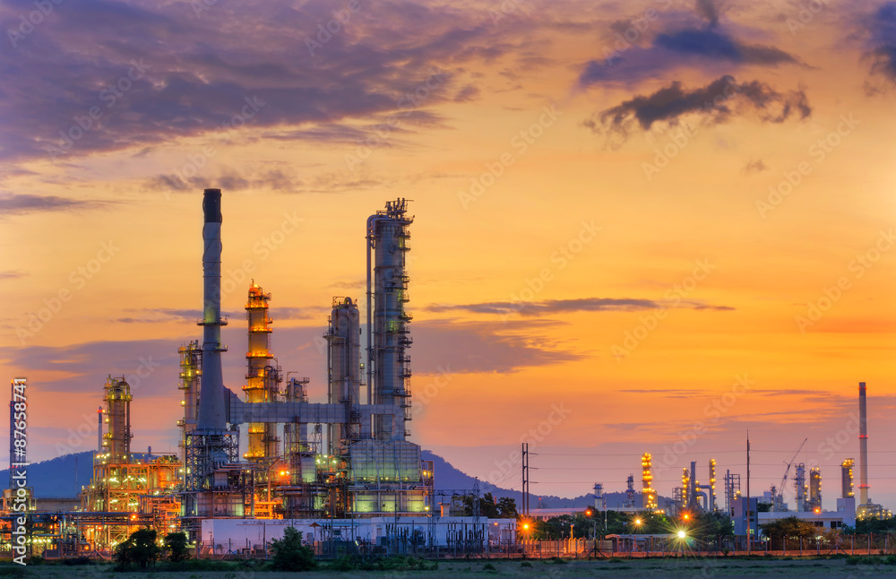 Fototapeta premium Oil refinery at twilight with sky background.