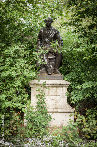 John Stuart Mill statue. A statue of the British philosopher and economist John Stuart Mill buried away amonst the foliage of Victoria Embankment Gardens, a public park close to Westminster Bridge.
