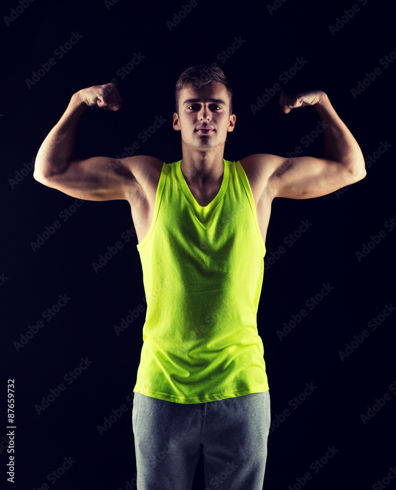 young man showing biceps young man showing biceps