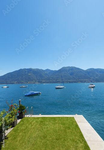 Architecture external platform on the lake with garden