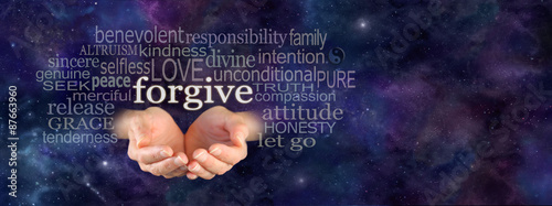 Full of Forgiveness - Cupped female hands emerging from panoramic deep space blue background with the word Forgive floating above surrounded by a relevant word cloud and copy space on right side photo