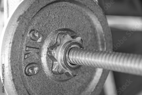 Barbell with 5 kg plate closeup