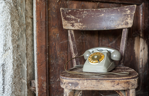 Vintage phone on a old chair