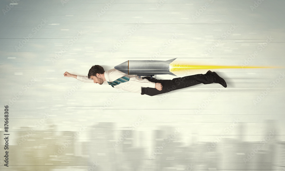 Superhero business man flying with jet pack rocket above the cit Superhero business man flying with jet pack rocket above the cit