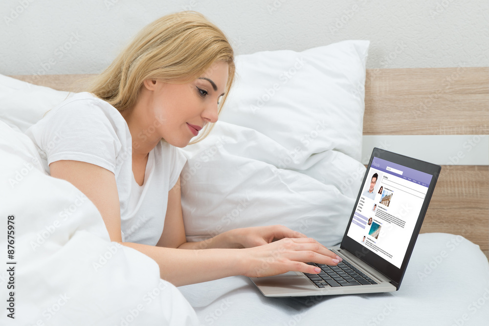 Woman With Laptop Chatting On Social Networking Site Woman With Laptop Chatting On Social Networking Site