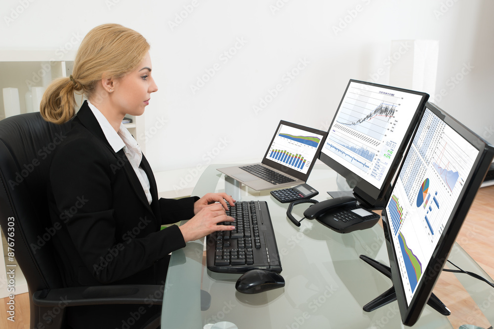 Businesswoman Working With Statistics Data On Computer Businesswoman Working With Statistics Data On Computer