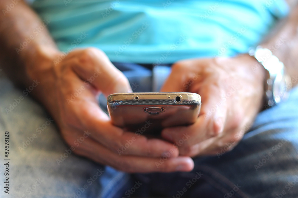 Close-up of man's hands with smartphone Close-up of man's hands with smartphone