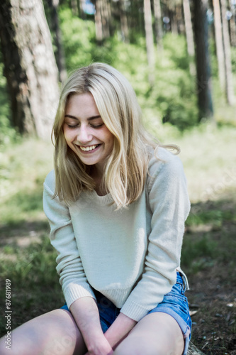 portrait of a beautiful young blonde in the forest, summer mood