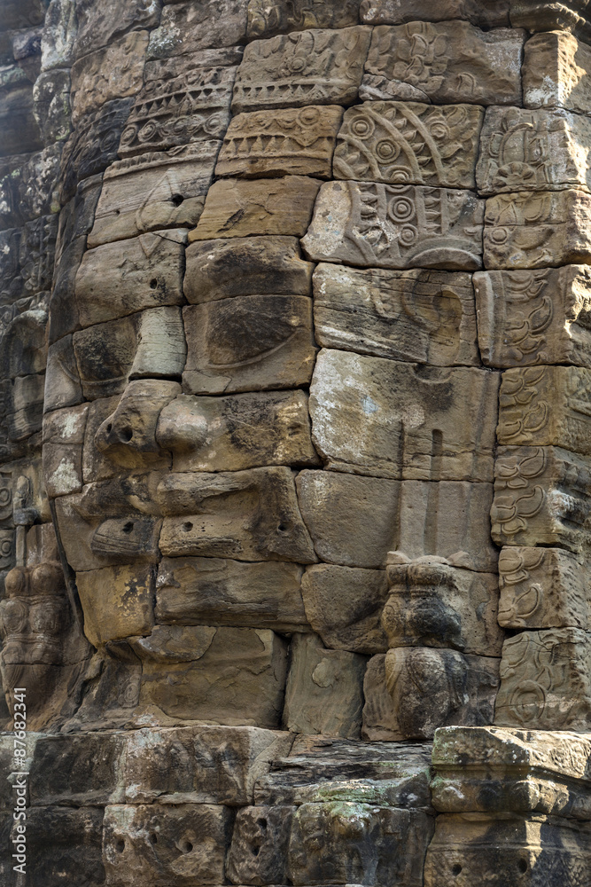 Ancient stone faces of king Jayavarman VII at The Bayon temple,
