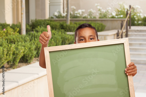 Boy with Thumbs Up Holding ...