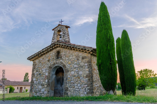 Sunset on a chapel in Villecroze in Provence, France photo