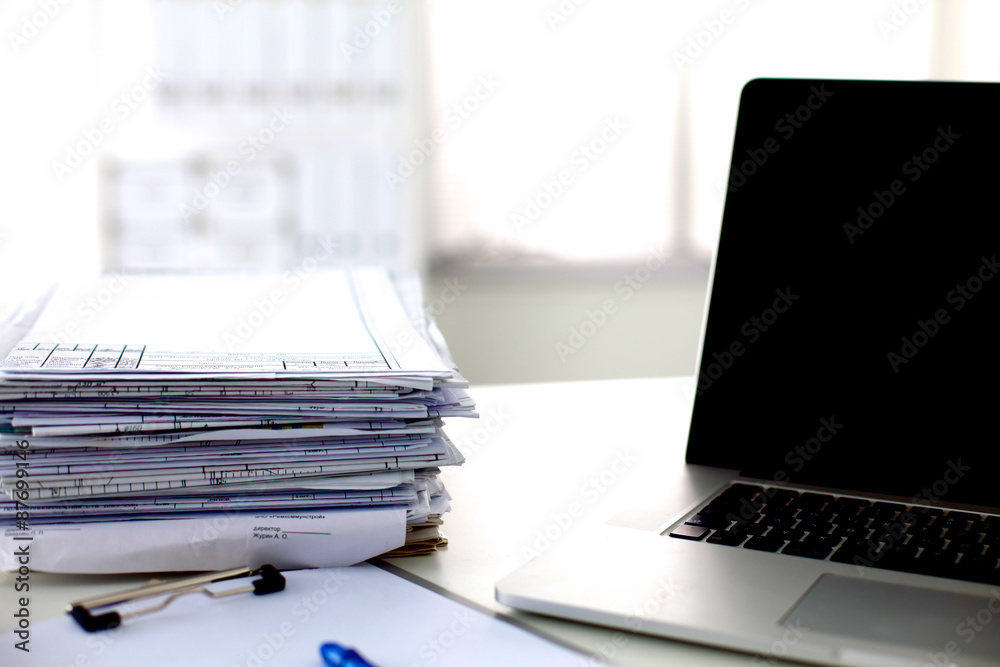 office desk a stack of computer paper reports work forms office desk a stack of computer paper reports work forms