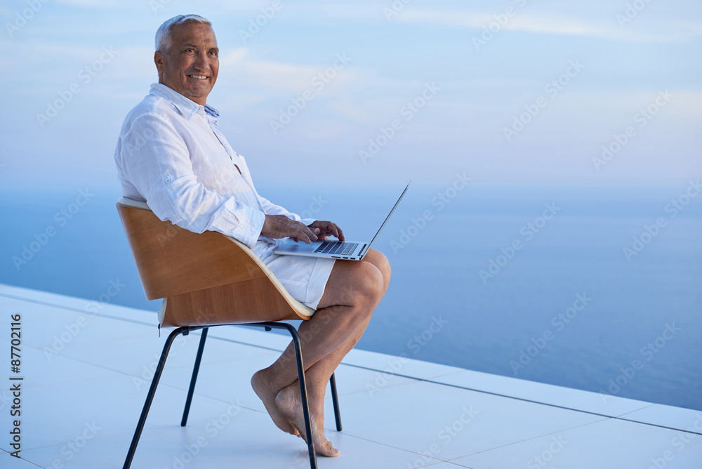 senior man working on laptop computer