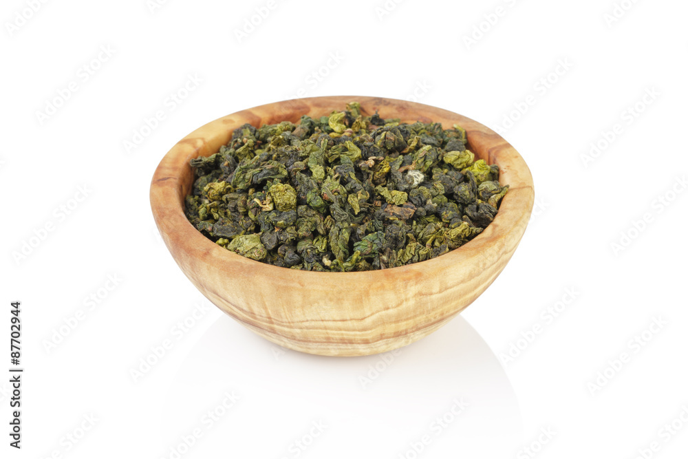 oolong green tea heap in bowl, isolated on white oolong green tea heap in bowl, isolated on white