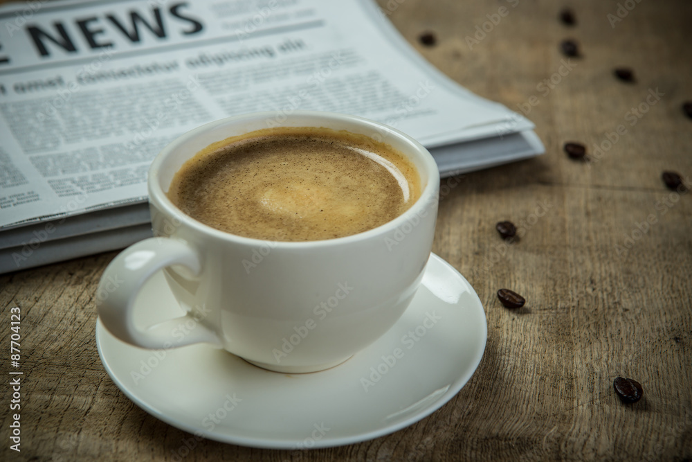 Close up glasses on newspaper and Coffee on the wooden table in Close up glasses on newspaper and Coffee on the wooden table in