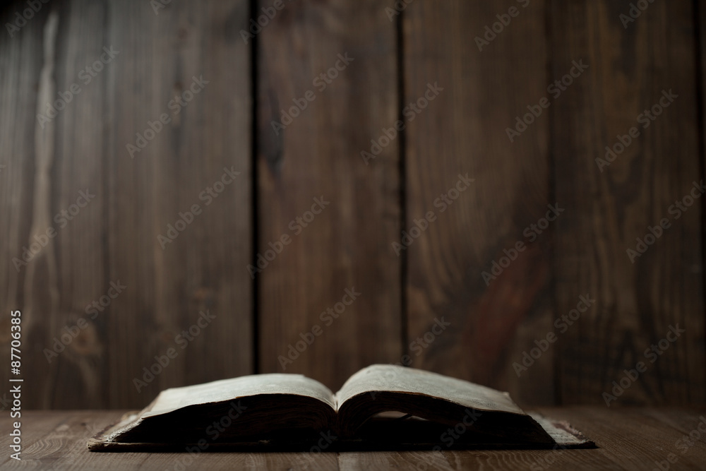 Holy Bible on wooden background - obrazy, fototapety, plakaty 