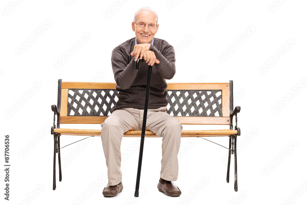 Senior gentleman sitting on a wooden bench Senior gentleman sitting on a wooden bench