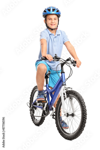 Little boy with blue helmet sitting on his bicycle © Ljupco Smokovski