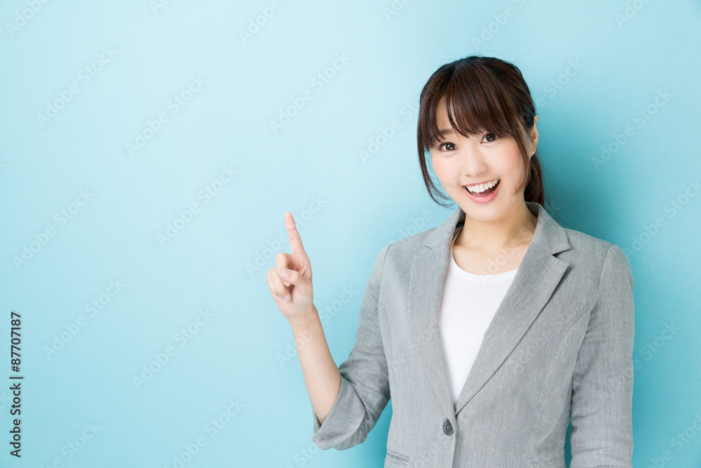 portrait of asian businesswoman on blue background portrait of asian businesswoman on blue background
