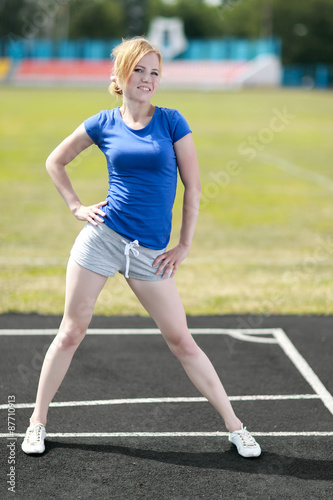 Fitness woman exercising outdoors © JENOCHE