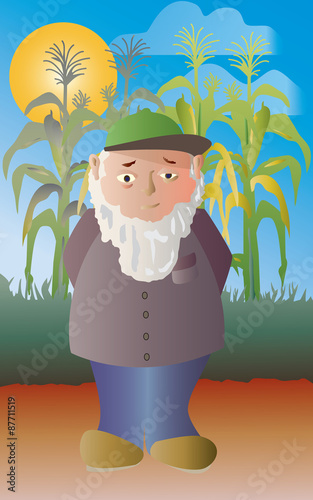 Farmer standing in front of a crop of sweetcorn ready to harvest  on a sunny day.