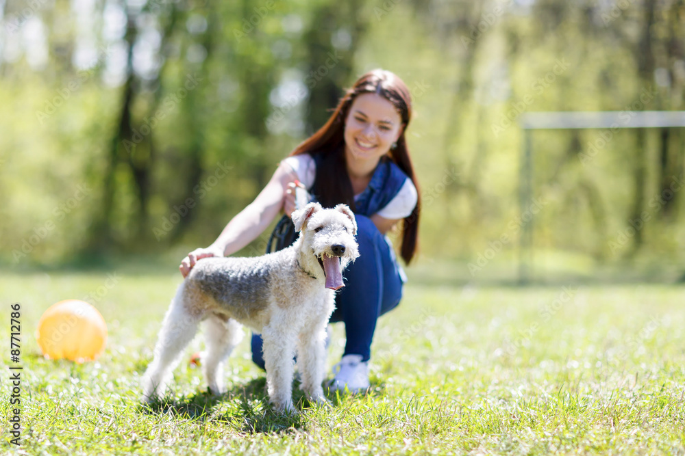 portrait of Beautiful young girl with her dogs  