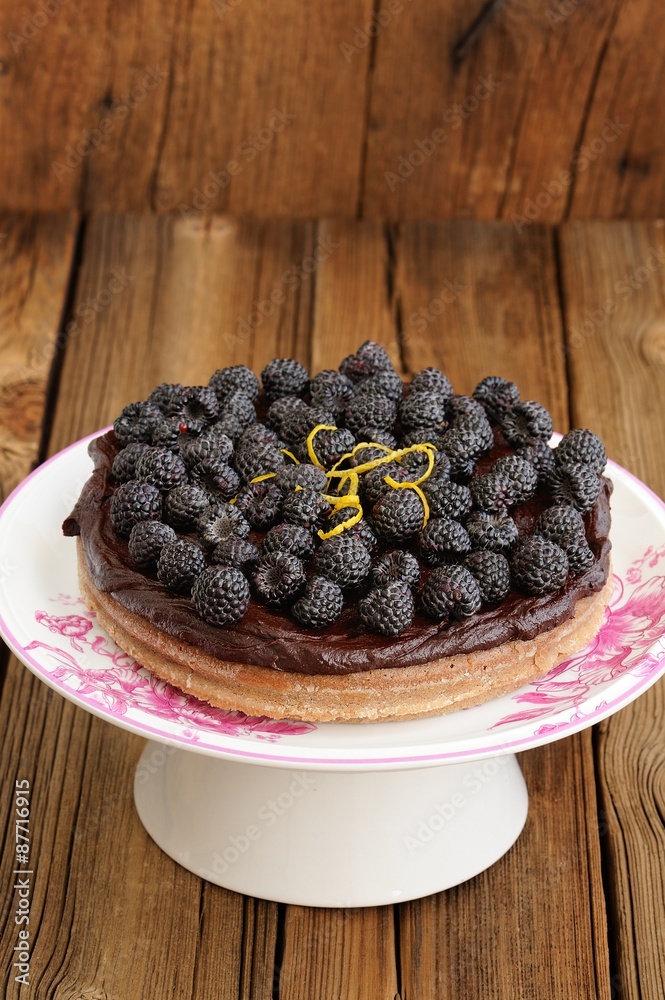 Tasty homemade chocolate pie with ganache, decorated with many f Tasty homemade chocolate pie with ganache, decorated with many f