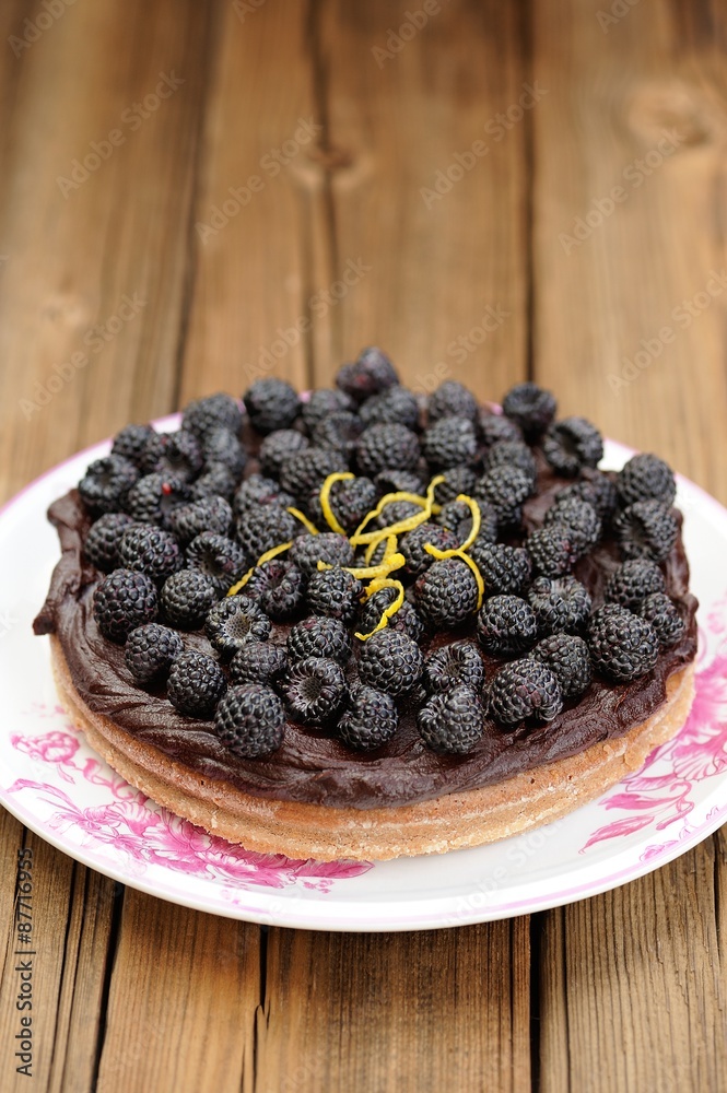 Fresh homemade chocolate pie with ganache, decorated with fresh Fresh homemade chocolate pie with ganache, decorated with fresh