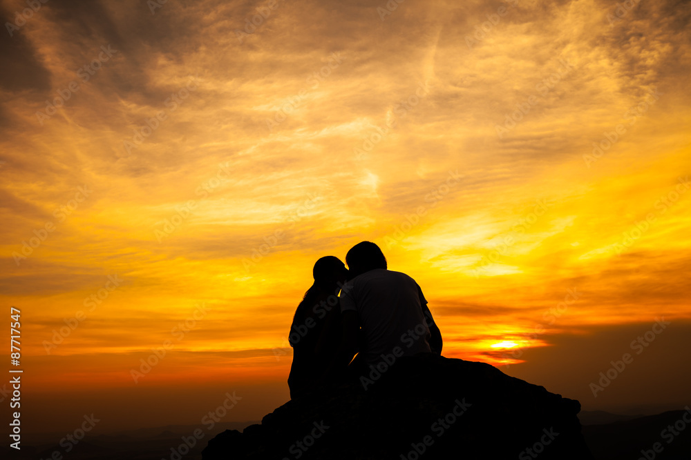 Silhouette of loving couple in sunset