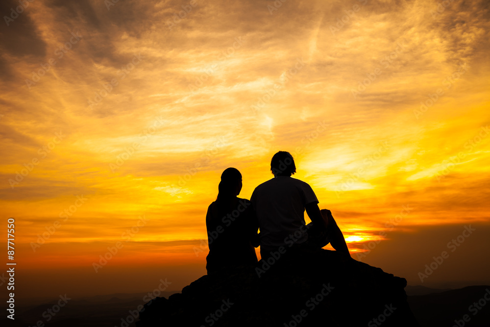 Silhouette of loving couple in sunset
