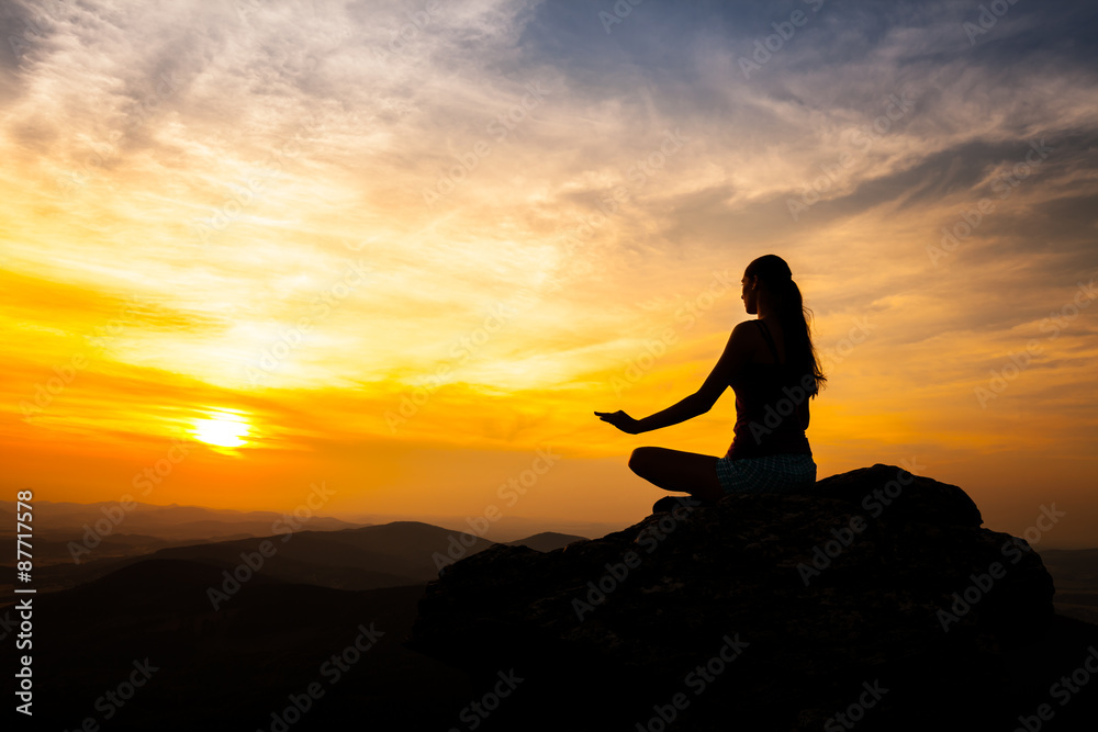Yoga practicioner in sunset