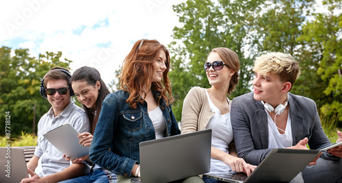 students or teenagers with laptop computers