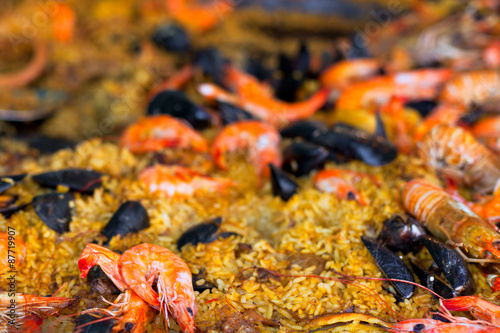 Traditional paella with seafood in a market