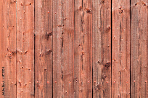 Old red rural wooden wall, detailed background photo